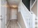 Bright entryway with updated wood floors, white trim, and stairs leading to the second floor at 11911 Maria Ester Ct, Charlotte, NC 28277
