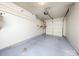 A clean garage with ample storage space and an automatic door at 11911 Maria Ester Ct, Charlotte, NC 28277