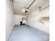 A clean garage with ample storage space and neutral paint at 11911 Maria Ester Ct, Charlotte, NC 28277