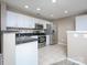 Modern kitchen features stainless steel appliances, white cabinets, and granite counters at 11911 Maria Ester Ct, Charlotte, NC 28277