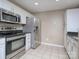 The kitchen offers stainless steel appliances and dark granite countertops at 11911 Maria Ester Ct, Charlotte, NC 28277