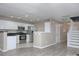 An open-concept kitchen features stainless steel appliances and ample storage at 11911 Maria Ester Ct, Charlotte, NC 28277