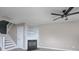 Living room featuring a fireplace, ceiling fan, and wood-look floors at 11911 Maria Ester Ct, Charlotte, NC 28277