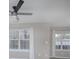 Bright and airy living room featuring two windows and neutral walls at 11911 Maria Ester Ct, Charlotte, NC 28277