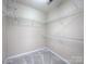 Empty walk-in closet with wire shelving and neutral carpet at 11911 Maria Ester Ct, Charlotte, NC 28277