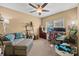 Comfortable bedroom featuring carpet floors, a ceiling fan, and ample natural light at 12545 Druids Glen Dr, Pineville, NC 28134