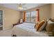 Bedroom featuring natural light, a ceiling fan, and neutral wall color at 12545 Druids Glen Dr, Pineville, NC 28134