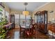 Formal dining room with hardwood floors, natural light, and elegant furniture at 12545 Druids Glen Dr, Pineville, NC 28134