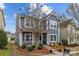 Charming two-story home with a covered front porch and well-maintained landscaping at 12545 Druids Glen Dr, Pineville, NC 28134