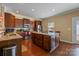 Well-equipped kitchen with a central island, stainless steel appliances, and granite counters at 12545 Druids Glen Dr, Pineville, NC 28134
