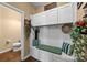 Inviting mudroom with built-in bench, storage cabinets, and decor at 12545 Druids Glen Dr, Pineville, NC 28134