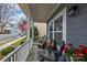Inviting front porch featuring comfortable seating to enjoy neighborhood views at 12545 Druids Glen Dr, Pineville, NC 28134