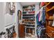 Well-organized walk-in closet featuring shelving and hanging space for clothing, shoes, and accessories at 12545 Druids Glen Dr, Pineville, NC 28134