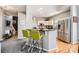 Open kitchen view featuring modern appliances, black countertops, and breakfast bar seating at 13604 Edgetree Dr, Pineville, NC 28134