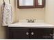 Bathroom vanity with dark wood and a white countertop at 1404 Lane Rd, Mount Holly, NC 28120