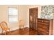 Bedroom with hardwood flooring, closet, dresser and chairs at 1404 Lane Rd, Mount Holly, NC 28120