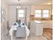 Open dining area with pendant light, and white cabinets, ideal for Gathering meals at 1404 Lane Rd, Mount Holly, NC 28120