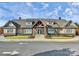 Exterior of the community clubhouse featuring an attractive stone and siding facade at 14920 High Bluff Ct, Charlotte, NC 28278
