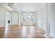 Elegant dining area featuring hardwood floors, white columns, and abundant natural light through large windows at 14920 High Bluff Ct, Charlotte, NC 28278