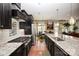 Gourmet kitchen featuring stainless steel appliances, granite countertops, and a spacious island at 14920 High Bluff Ct, Charlotte, NC 28278