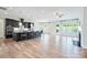 Open-concept kitchen with dark cabinets, stainless steel appliances, and an island with bar seating at 14920 High Bluff Ct, Charlotte, NC 28278