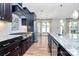 Gourmet kitchen featuring stainless steel appliances, granite countertops, and a spacious island at 14920 High Bluff Ct, Charlotte, NC 28278