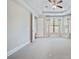 Large bedroom with tray ceilings, fan, and ample natural light with a view to the yard at 14920 High Bluff Ct, Charlotte, NC 28278