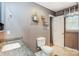 Well-lit bathroom with a granite vanity and wall shelving to provide both elegance and functionality at 1625 Saint Paul Church Rd, Salisbury, NC 28146