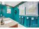 Bathroom showcasing bright teal walls, granite countertops, and neatly arranged towels at 1625 Saint Paul Church Rd, Salisbury, NC 28146