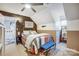 Cozy bedroom features a decorative wood accent wall and ensuite bath for a relaxing retreat at 1625 Saint Paul Church Rd, Salisbury, NC 28146