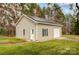 Modern outbuilding featuring solar panels, a garage door, and clean architectural lines at 1625 Saint Paul Church Rd, Salisbury, NC 28146
