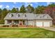 Charming single-Gathering home featuring a well-manicured lawn, attached two-car garage, and a welcoming covered front porch at 1625 Saint Paul Church Rd, Salisbury, NC 28146