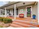 Charming front porch with seating and decorative accents adding curb appeal to the home at 1625 Saint Paul Church Rd, Salisbury, NC 28146