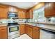 Well-maintained kitchen with stainless steel appliances, a window view, and ample storage space at 1625 Saint Paul Church Rd, Salisbury, NC 28146