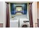 A dedicated laundry room, complete with storage cabinets and modern machines, offers a practical and organized space at 1625 Saint Paul Church Rd, Salisbury, NC 28146