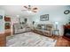 Inviting living room with hardwood floors, modern furniture, ceiling fan, and decor creating a cozy space at 1625 Saint Paul Church Rd, Salisbury, NC 28146