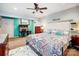 Spacious main bedroom featuring soft carpet, fan, decor, and colorful bedding for a cozy retreat at 1625 Saint Paul Church Rd, Salisbury, NC 28146