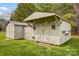 Charming outbuilding features ample storage space and charming details like hanging lanterns and flower boxes at 1625 Saint Paul Church Rd, Salisbury, NC 28146