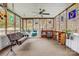 Bright sunroom featuring large windows, cozy seating, and potted plants, perfect for relaxation at 1625 Saint Paul Church Rd, Salisbury, NC 28146
