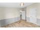 Bright bedroom featuring two closets and paneled wainscoting at 1641 Knoll Dr, Vale, NC 28168