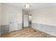Bright bedroom featuring hardwood floors, painted walls, and multiple doors at 1641 Knoll Dr, Vale, NC 28168