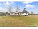 Charming single-story home with a covered front porch and spacious front yard at 1641 Knoll Dr, Vale, NC 28168