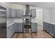 Modern kitchen featuring stainless steel appliances and sleek gray cabinetry at 1641 Knoll Dr, Vale, NC 28168