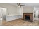 Cozy living room with a classic brick fireplace and neutral decor at 1641 Knoll Dr, Vale, NC 28168