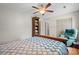 Comfortable bedroom with ceiling fan, bookshelf, and a cozy recliner chair, great for relaxing at 16417 Grapperhall Dr, Huntersville, NC 28078