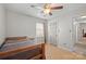 Bedroom with ceiling fan, and natural light from the window. Closet is to the right at 16417 Grapperhall Dr, Huntersville, NC 28078