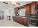 Cherry cabinets, tile backsplash, stainless steel appliances, and tile floor at 16417 Grapperhall Dr, Huntersville, NC 28078