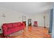 Bright living room with hardwood floors, comfortable seating, and ample natural light at 16417 Grapperhall Dr, Huntersville, NC 28078