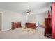 Bedroom features a ceiling fan, neutral carpet, and wood furniture at 16417 Grapperhall Dr, Huntersville, NC 28078