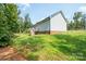 Back of home featuring a small deck, grass and a view of the natural surroundings at 1700 Ivey Ct, Maiden, NC 28650
